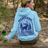 This Manitoba hoodie captures the beauty of Canada’s backcountry with a moose silhouette surrounded by starlit skies, tall evergreens, and a crescent moon.