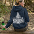 Celebrate the wild spirit of Manitoba with this eye-catching hoodie featuring "Manitoba" written in a unique tree branch font.
