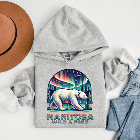 Featuring a majestic polar bear set against the breathtaking backdrop of the northern lights, this hoodie celebrates the spirit of Manitoba’s wild landscapes.
