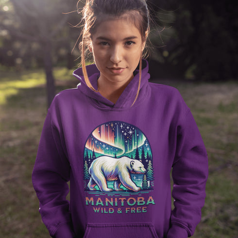 Featuring a majestic polar bear set against the breathtaking backdrop of the northern lights, this hoodie celebrates the spirit of Manitoba’s wild landscapes.