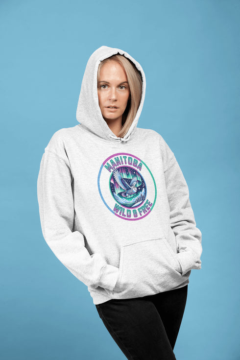 Featuring a stunning graphic of a majestic snowy owl in flight, set against the glowing northern lights, this hoodie embodies the freedom and grace of the province’s untamed wilderness.
