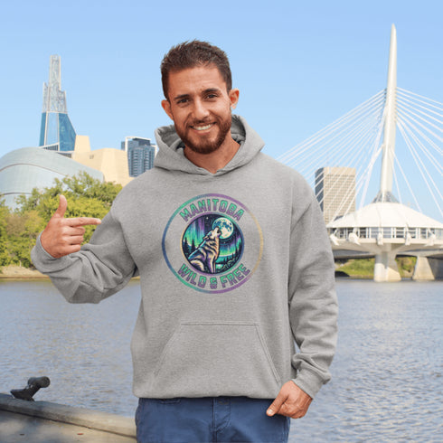 Featuring a powerful graphic of a wolf howling at the moon beneath a sky lit up by the mesmerizing northern lights, this hoodie captures the untamed beauty of Manitoba.