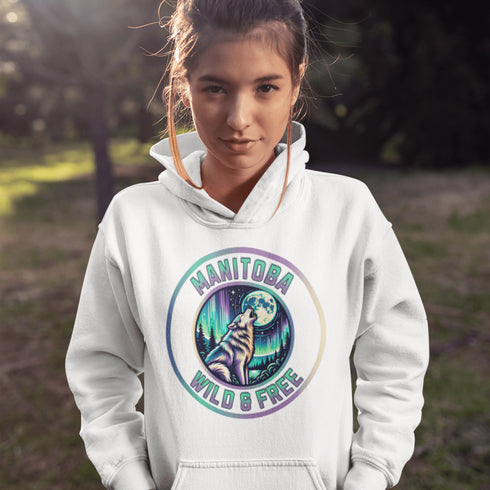 Featuring a powerful graphic of a wolf howling at the moon beneath a sky lit up by the mesmerizing northern lights, this hoodie captures the untamed beauty of Manitoba.