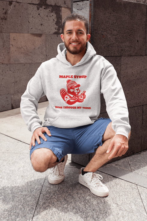 This hoodie Features a beaver decked out in a Canada shirt and hat while holding a bottle of maple syrup, this design is a tribute to Canada’s sweetest obsession.