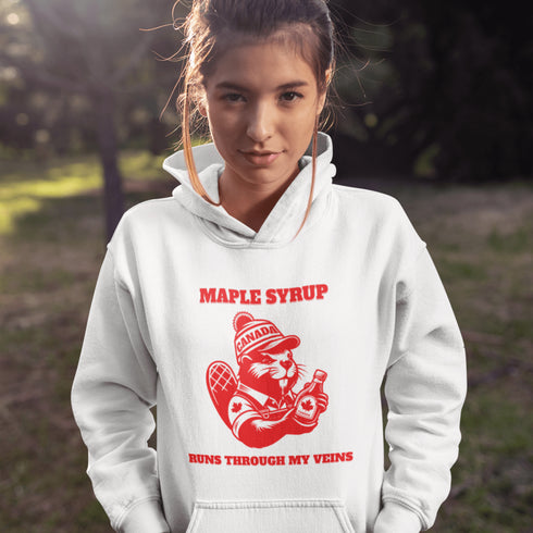 This hoodie Features a beaver decked out in a Canada shirt and hat while holding a bottle of maple syrup, this design is a tribute to Canada’s sweetest obsession.