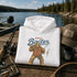 Funny Sasquatch fishing graphic printed on a unisex hoodie featuring a vintage Bigfoot fisherman design, shown on multiple hoodie colors and lifestyle mockups perfect for outdoor and fishing apparel.