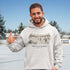 Meet You at the Rink Hoodie – cozy outdoor hockey sweatshirt inspired by backyard rink memories. Unisex fit. Multiple colors available.