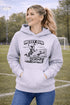 Woman wearing a Messy Bun & Getting It Done soccer mom hoodie with vintage soccer design