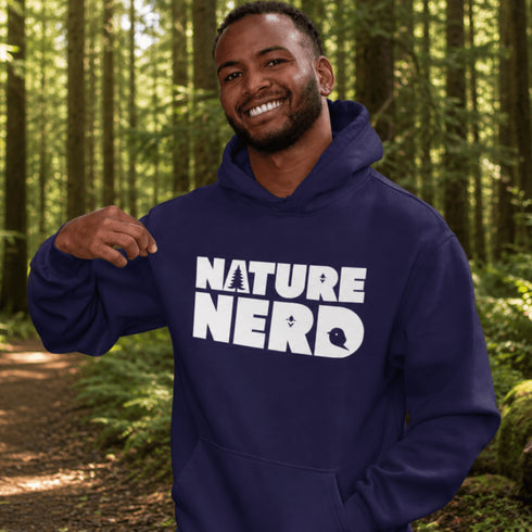Man wearing a blue hoodie with 'Nature Nerd' text in a forest setting
