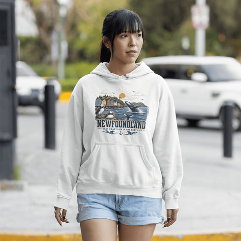 Woman wearing a hoodie with a 'Newfoundland' design on a street.