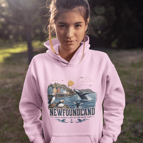 Newfoundland graphic hoodie featuring puffins, whale, fishing village, and coastal East Coast Canada design on a unisex sweatshirt