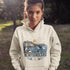 Newfoundland graphic hoodie featuring puffins, whale, fishing village, and coastal East Coast Canada design on a unisex sweatshirt