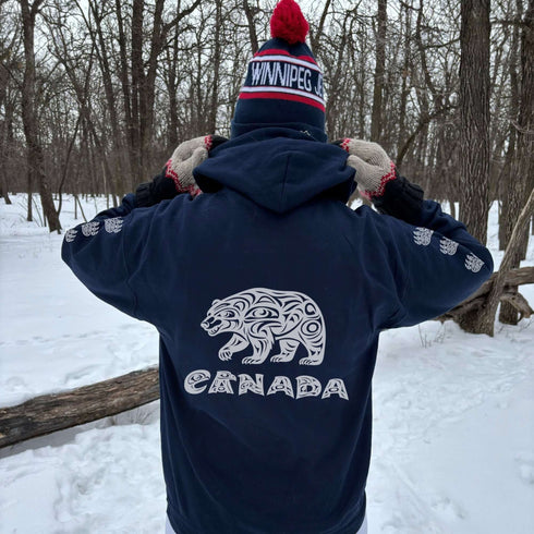 Northern Heritage Bear Hoodie featuring Indigenous-inspired bear artwork and bear paw sleeve graphics. Cozy Canada pullover sweatshirt built for warmth, heritage, and style.