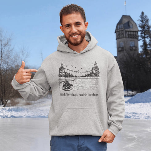 Cozy outdoor hockey hoodie featuring a glowing rink graphic and prairie winter vibe. Perfect for skating, cabin nights, and cold-weather comfort.