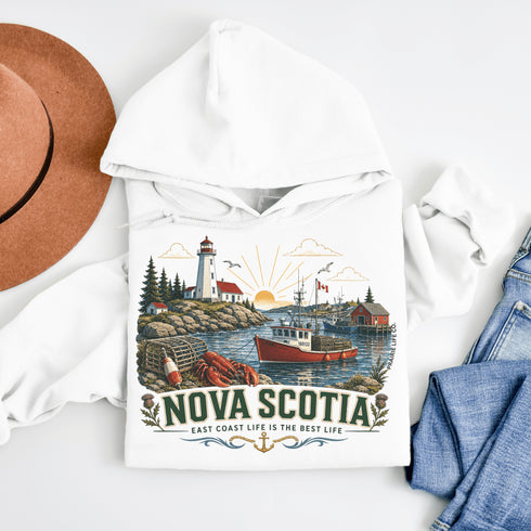 White hoodie with Nova Scotia design featuring a lighthouse, boat, and lobster trap.
