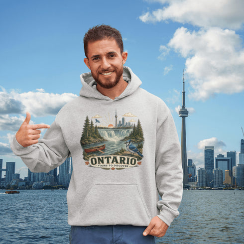 Man wearing a hoodie with Ontario design in front of a city skyline