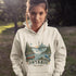 Person wearing a hoodie with Ontario-themed design outdoors
