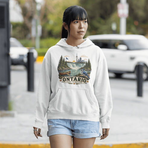 Woman wearing a hoodie with an 'Ontario' design on a street.