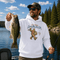 Unisex Gildan 18500 hoodie featuring a vintage-style Bigfoot fishing graphic with the phrase "Out Here Living My Best Life," available in multiple colors.