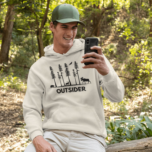 The Outsider Hoodie features a charming forest scene with a moose, a bear, and a deer—aka the unspoken rulers of the woods.