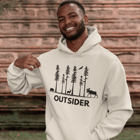 The Outsider Hoodie features a charming forest scene with a moose, a bear, and a deer—aka the unspoken rulers of the woods.