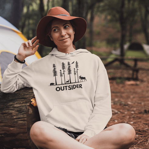 The Outsider Hoodie features a charming forest scene with a moose, a bear, and a deer—aka the unspoken rulers of the woods.