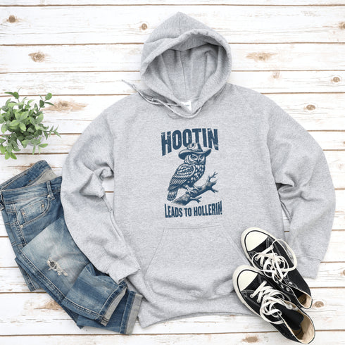 Rocking a cowboy hat and perched on a tree branch, this feathered outlaw knows the golden rule of life: Hootin’ leads to hollerin’.