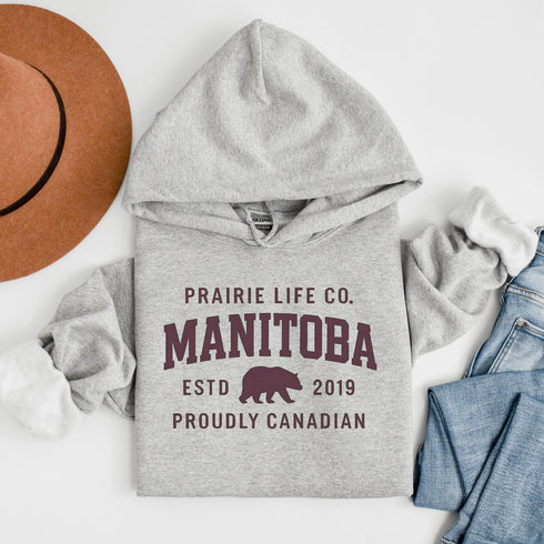 Celebrate your roots in comfort and style with our Heritage Hoodie, a timeless classic designed for proud Manitobans and Canadians alike.