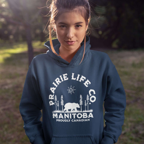 Featuring a bold graphic of a majestic bear surrounded by trees, this hoodie is perfect for those who love exploring nature or simply want to carry a bit of wilderness with them wherever they go.