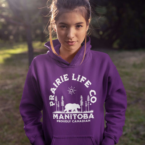 Featuring a bold graphic of a majestic bear surrounded by trees, this hoodie is perfect for those who love exploring nature or simply want to carry a bit of wilderness with them wherever they go.