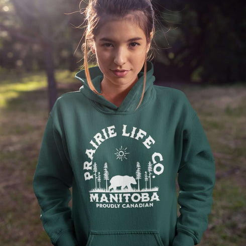 Featuring a bold graphic of a majestic bear surrounded by trees, this hoodie is perfect for those who love exploring nature or simply want to carry a bit of wilderness with them wherever they go.