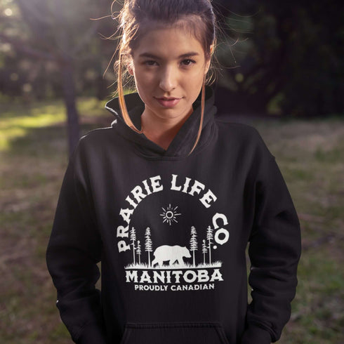 Featuring a bold graphic of a majestic bear surrounded by trees, this hoodie is perfect for those who love exploring nature or simply want to carry a bit of wilderness with them wherever they go.