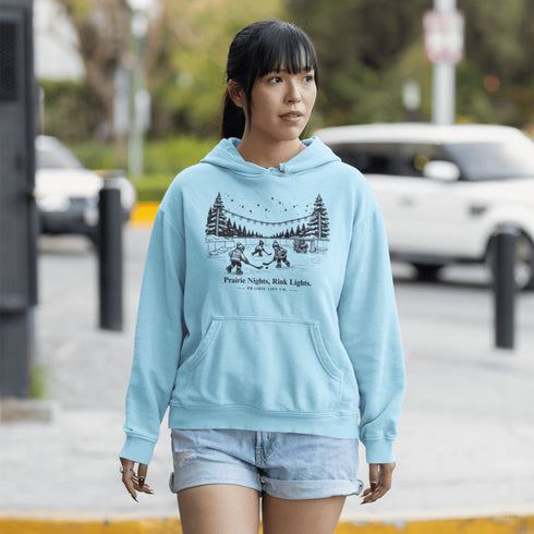 Nostalgic small town hockey hoodie inspired by pond hockey and community rink nights. Cozy fleece sweatshirt perfect for hockey moms and winter rink life.