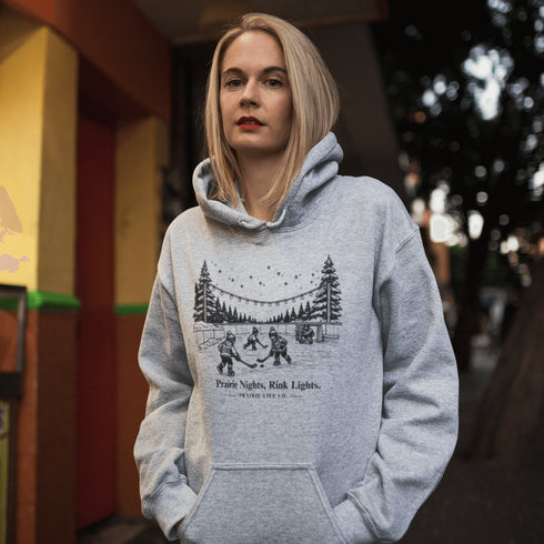 Nostalgic small town hockey hoodie inspired by pond hockey and community rink nights. Cozy fleece sweatshirt perfect for hockey moms and winter rink life.