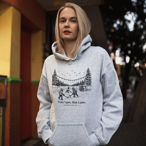 Nostalgic small town hockey hoodie inspired by pond hockey and community rink nights. Cozy fleece sweatshirt perfect for hockey moms and winter rink life.