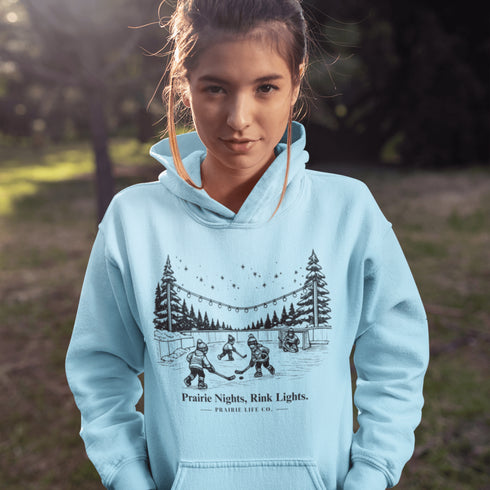 Nostalgic small town hockey hoodie inspired by pond hockey and community rink nights. Cozy fleece sweatshirt perfect for hockey moms and winter rink life.