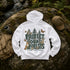 A white pullover hoodie laid flat on a mossy rock outdoors, with a large forest-themed back graphic reading “PROTECT OUR FORESTS” and “PLANET OVER PROFIT,” plus illustrated animals and butterflies. A tan cap, backpack, and water bottle are placed around it in a natural outdoor setting.