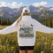 Unisex Gildan 18500 hoodie featuring a matching left chest graphic and a large vintage-inspired back design celebrating pollinators, wildflowers, bees, butterflies, and hummingbirds. Available in multiple colors for hiking, gardening, camping, nature lovers, and everyday outdoor wear.
