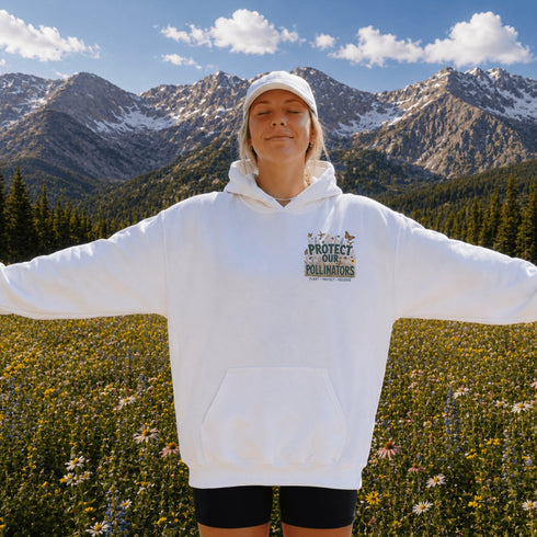 Unisex Gildan 18500 hoodie featuring a matching left chest graphic and a large vintage-inspired back design celebrating pollinators, wildflowers, bees, butterflies, and hummingbirds. Available in multiple colors for hiking, gardening, camping, nature lovers, and everyday outdoor wear.