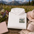Unisex Gildan 18500 hoodie featuring a matching left chest graphic and a large vintage-inspired back design celebrating pollinators, wildflowers, bees, butterflies, and hummingbirds. Available in multiple colors for hiking, gardening, camping, nature lovers, and everyday outdoor wear.
