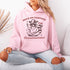 This hoodie combines the wisdom of the Wild West with the zen of overstimulation recovery. Featuring a raccoon—rocking a cowboy hat, and meditating.