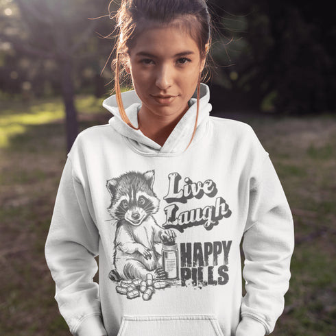 Introducing the "Live, Laugh, Happy Pills" Hoodie—because who better to take life advice from than a raccoon with a bottle of questionable pharmaceuticals? 🦝💊