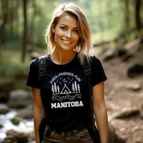 Introducing our exclusive camping t-shirt featuring a camping scene and the catchy slogan "Manitoba - Fires, Friends, Fun."