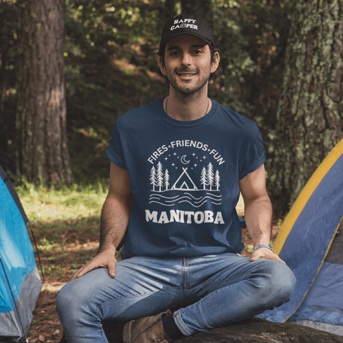 Introducing our exclusive camping t-shirt featuring a camping scene and the catchy slogan "Manitoba - Fires, Friends, Fun."