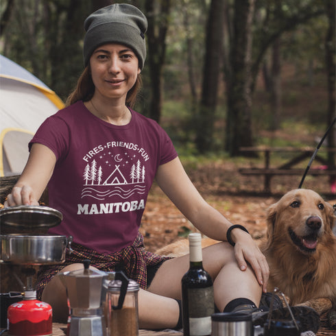 Introducing our exclusive camping t-shirt featuring a camping scene and the catchy slogan "Manitoba - Fires, Friends, Fun."