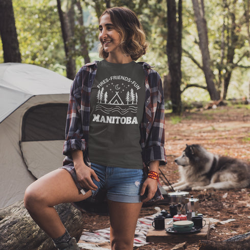 Introducing our exclusive camping t-shirt featuring a camping scene and the catchy slogan "Manitoba - Fires, Friends, Fun."