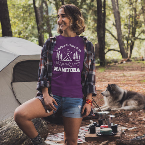 Introducing our exclusive camping t-shirt featuring a camping scene and the catchy slogan "Manitoba - Fires, Friends, Fun."