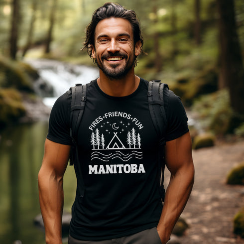 Introducing our exclusive camping t-shirt featuring a camping scene and the catchy slogan "Manitoba - Fires, Friends, Fun."