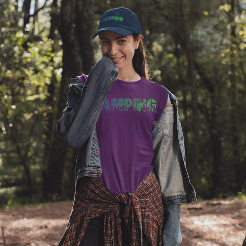 This unique tee features a captivating camping scene intricately etched inside the word "Camping," creating a stunning visual that captures the essence of outdoor adventure.