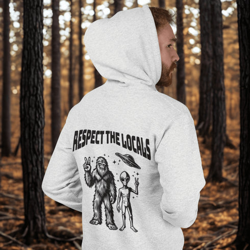 The Respect the Locals Hoodie features this dynamic duo (Big Foot & Alien) striking a pose like they’re on the cover of Paranormal Weekly